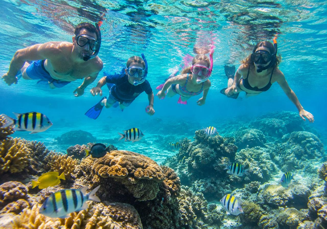 Family enjoying a Caribbean beach vacation together